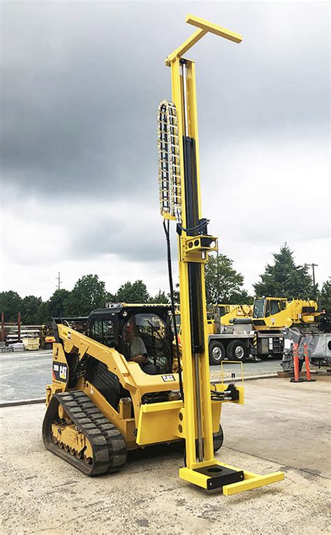 drill mast + skid steer|skid steer mounted rock drill.